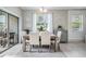 Bright dining area with a modern chandelier and a view of the backyard at 4550 Globe Thistle Dr, Tampa, FL 33619