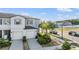 Charming townhome featuring an attached two-car garage, well-manicured landscaping, and a welcoming facade at 4550 Globe Thistle Dr, Tampa, FL 33619