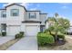 Charming townhome with well-maintained landscaping, a two-car garage, and a welcoming entrance at 4550 Globe Thistle Dr, Tampa, FL 33619