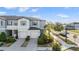 Charming townhome featuring a landscaped front yard and attached garages at 4550 Globe Thistle Dr, Tampa, FL 33619