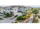 Beautiful townhome showcasing a landscaped front yard and attached garages at 4550 Globe Thistle Dr, Tampa, FL 33619