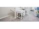 Cozy hallway with a work station featuring a white desk and chair at 4550 Globe Thistle Dr, Tampa, FL 33619