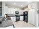 Modern kitchen equipped with stainless steel appliances and granite countertops at 4550 Globe Thistle Dr, Tampa, FL 33619