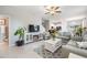 Inviting living room with modern decor, tile flooring, and a cozy fireplace feature at 4550 Globe Thistle Dr, Tampa, FL 33619
