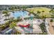 Community splash pad with colorful slides, water features, and palm trees, providing refreshing fun for residents at 4550 Globe Thistle Dr, Tampa, FL 33619