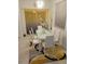 Modern dining room featuring a white table with matching chairs and stylish yellow rug at 5131 Forum Blvd, Holiday, FL 34690