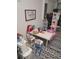 Fun playroom features toy kitchen, table, chairs, and graphic rug at 5131 Forum Blvd, Holiday, FL 34690