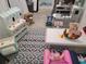 Well-organized playroom with toy kitchen, market stand, and patterned rug at 5131 Forum Blvd, Holiday, FL 34690