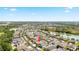 Beautiful aerial view of a residential community with lakes and modern homes under a clear sky at 5453 Suncatcher Dr, Wesley Chapel, FL 33545