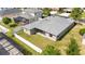 Aerial view of the property with a fenced backyard, screened-in pool, and gray roof at 5453 Suncatcher Dr, Wesley Chapel, FL 33545
