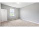 Neutral bedroom featuring carpet and a window, freshly painted and move-in ready at 5453 Suncatcher Dr, Wesley Chapel, FL 33545