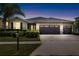 Charming home with a well-manicured lawn, three-car garage, and tasteful landscaping at 5453 Suncatcher Dr, Wesley Chapel, FL 33545
