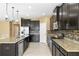 Modern kitchen with granite countertops, stainless steel appliances, and a central island at 5453 Suncatcher Dr, Wesley Chapel, FL 33545