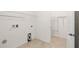 Tiled laundry room featuring in-wall hookups for washer and dryer at 5453 Suncatcher Dr, Wesley Chapel, FL 33545
