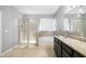 Modern bathroom with granite counters, a separate shower and tub with decorative tile at 5453 Suncatcher Dr, Wesley Chapel, FL 33545