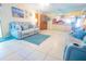 Inviting living room with tile flooring and easy access to the kitchen, creating a seamless flow at 55 Squire Ct, Dunedin, FL 34698