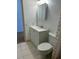 Bright bathroom featuring a white vanity, and toilet with tiled floors at 5660 80Th N St # A102, St Petersburg, FL 33709