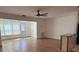 Bright living room area with hardwood floors and lots of natural light streaming through the window at 5660 80Th N St # A102, St Petersburg, FL 33709