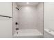 Bathroom featuring a new shower with white subway tile, a black shower head and black hardware at 6136 56Th N Ave, St Petersburg, FL 33709