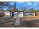 View of the home's exterior showcasing the backyard and entrance at 6136 56Th N Ave, St Petersburg, FL 33709