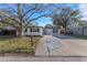 Charming single-story home with a well-maintained lawn and a concrete driveway at 6136 56Th N Ave, St Petersburg, FL 33709