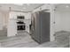 Contemporary kitchen with stainless steel appliances, white cabinetry, and modern countertops at 6136 56Th N Ave, St Petersburg, FL 33709