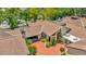 Aerial view of the home showing well manicured landscaping, driveway, and partial roof at 713 Dorado Ct, Brandon, FL 33511