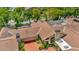 An aerial view highlights the home's mature landscaping and driveway at 713 Dorado Ct, Brandon, FL 33511