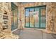 Walk-in shower featuring rainfall shower head, shower bench and outdoor access at 713 Dorado Ct, Brandon, FL 33511