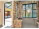 Unique shower with dual shower heads, stone walls, window and outdoor view at 713 Dorado Ct, Brandon, FL 33511