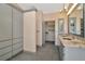 Bathroom featuring tile floors, granite countertop, closet and lots of storage space at 713 Dorado Ct, Brandon, FL 33511