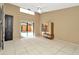 Bright bedroom with tile flooring, ceiling fan, and sliding glass doors to the pool at 713 Dorado Ct, Brandon, FL 33511