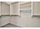 Spacious walk-in closet featuring built-in shelving and ample storage space at 713 Dorado Ct, Brandon, FL 33511