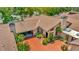 Aerial view of home featuring well manicured landscaping, and circular driveway at 713 Dorado Ct, Brandon, FL 33511
