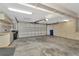 Spacious two car garage with plenty of storage cabinets along back wall at 713 Dorado Ct, Brandon, FL 33511