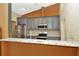 Bright kitchen with stainless steel appliances and speckled granite countertops at 713 Dorado Ct, Brandon, FL 33511