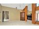 Open living room featuring a crystal chandelier, fireplace, a large mirror, and neutral color walls at 713 Dorado Ct, Brandon, FL 33511