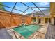 A private screened-in pool sits on brick pavers with ample space for outdoor enjoyment at 713 Dorado Ct, Brandon, FL 33511