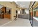 Sunroom with built-in bar, tile floors, and sliding glass doors leading to the pool at 713 Dorado Ct, Brandon, FL 33511