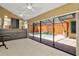 Spacious sunroom features a wet bar and sliding doors open to a screened pool area at 713 Dorado Ct, Brandon, FL 33511