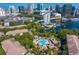 Aerial view of the community pool with nearby skyline views and lush trees surrounding the area at 728 Seagate Dr, Tampa, FL 33602