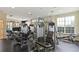 Well-equipped gym featuring various weight machines and ample natural light from large windows at 728 Seagate Dr, Tampa, FL 33602