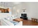 Bright living room with hardwood floors, white sofas, and access to a modern kitchen at 728 Seagate Dr, Tampa, FL 33602