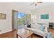 Open living space with a balcony view, comfortable seating, and modern decor at 728 Seagate Dr, Tampa, FL 33602