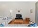 Comfortable living room featuring a large television, hardwood floors and simple decor at 728 Seagate Dr, Tampa, FL 33602