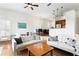Open living space featuring modern furniture, hardwood flooring and easy access to kitchen at 728 Seagate Dr, Tampa, FL 33602