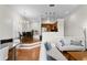 Bright, open-concept living space with hardwood floors, dining area, and modern kitchen at 728 Seagate Dr, Tampa, FL 33602