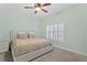 Airy main bedroom offers carpeted floors, a ceiling fan, and a large window at 728 Seagate Dr, Tampa, FL 33602