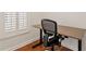 This home office features a contemporary chair, desk, and large window at 728 Seagate Dr, Tampa, FL 33602