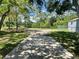 Backyard view featuring lush greenery, a fenced yard, and a tranquil outdoor space at 772 71St N Ave, St Petersburg, FL 33702